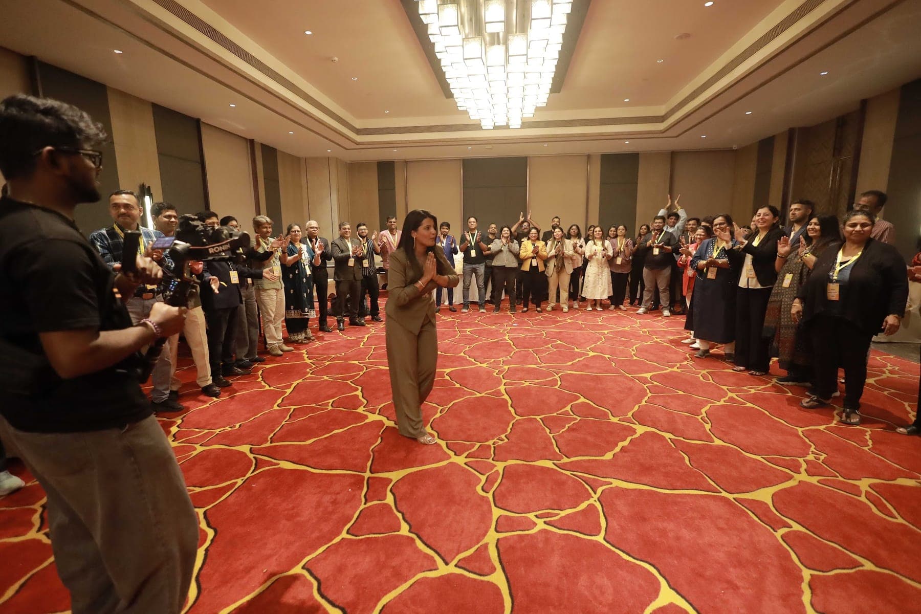 Tripti leading a large corporate workshop activity
