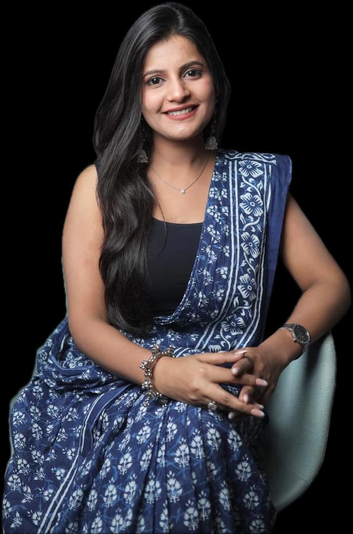 Tripti Sharma, psychologist and founder of Unmasking Minds, seated in a blue saree