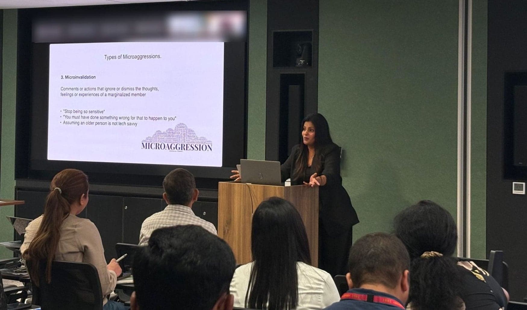 Tripti presenting on microaggressions to a Barclays team