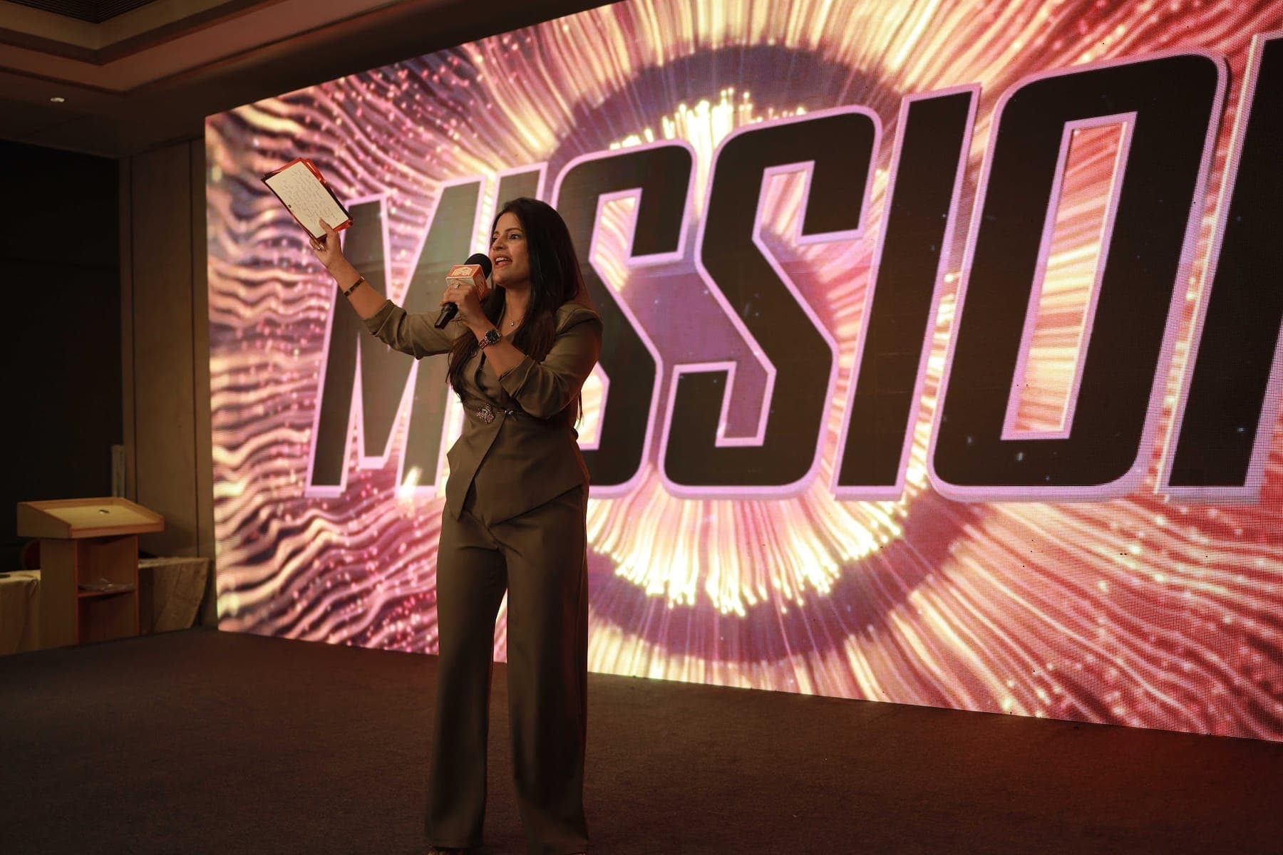 Tripti energising the room on stage